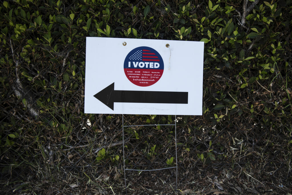 A voting sign outside a polling station in Los Angeles on June 7, 2022. Photo by Pablo Unzueta for CalMatters