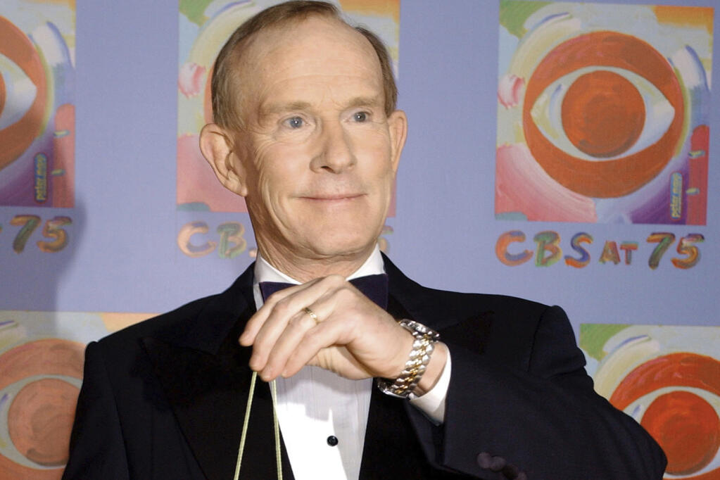Tom Smothers does yo-yo tricks during arrivals at CBS's 75th anniversary celebration Sunday, Nov. 2, 2003, in New York. Tom Smothers, half of the Smother Brothers and the co-host of one of the most socially conscious and groundbreaking television shows in the history of the medium, died Tuesday, Dec. 26, 2023 at 86. (AP Photo/Louis Lanzano, File)