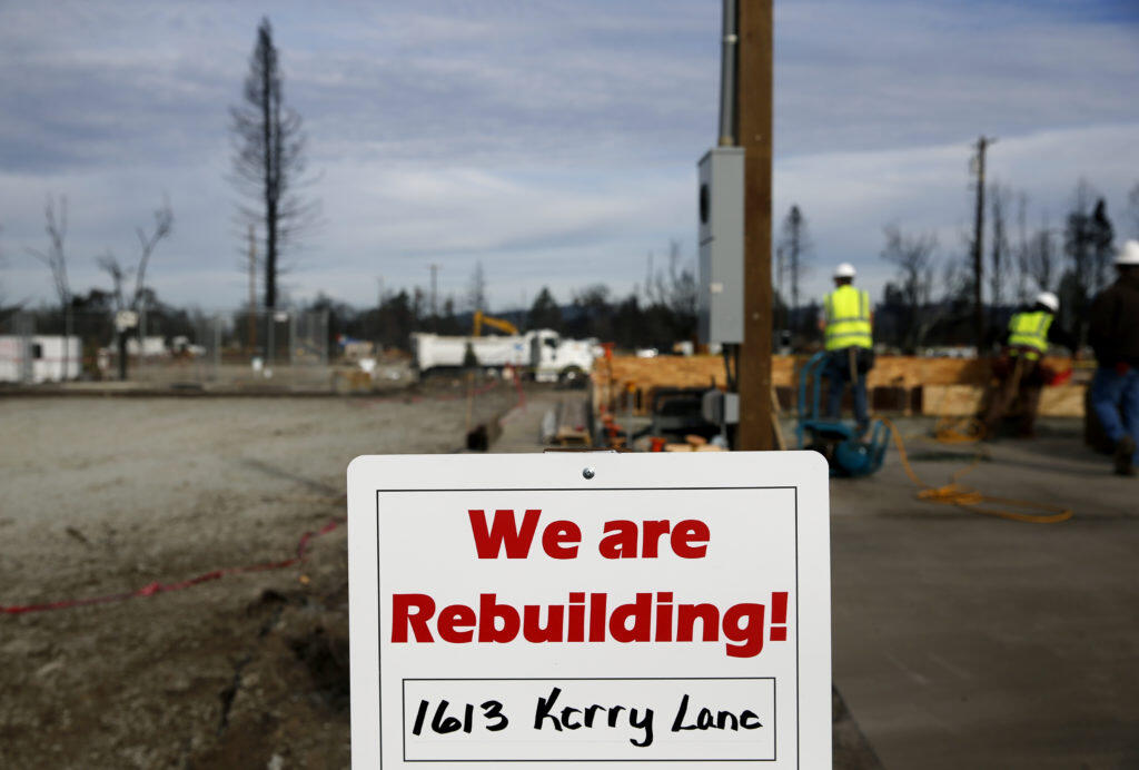 A sign announces that the home on Kerry Lane is being rebuilt in Coffey Park in Santa Rosa, on Tuesday, Jan. 2, 2018. (Beth Schlanker/ The Press Democrat, 2018)