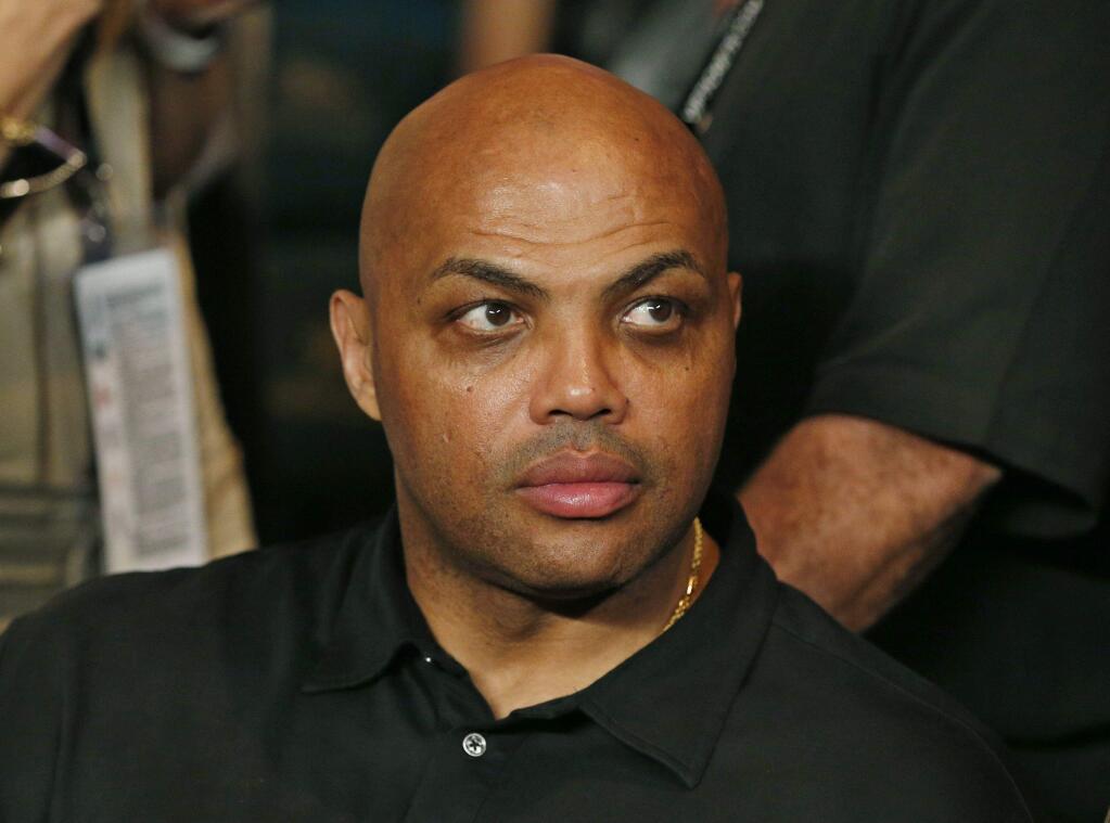 In this May 2, 2015, file photo, Charles Barkley joins the crowd before the start of the world welterweight championship bout between Floyd Mayweather Jr., and Manny Pacquiao in Las Vegas. (AP Photo/John Locher, File)