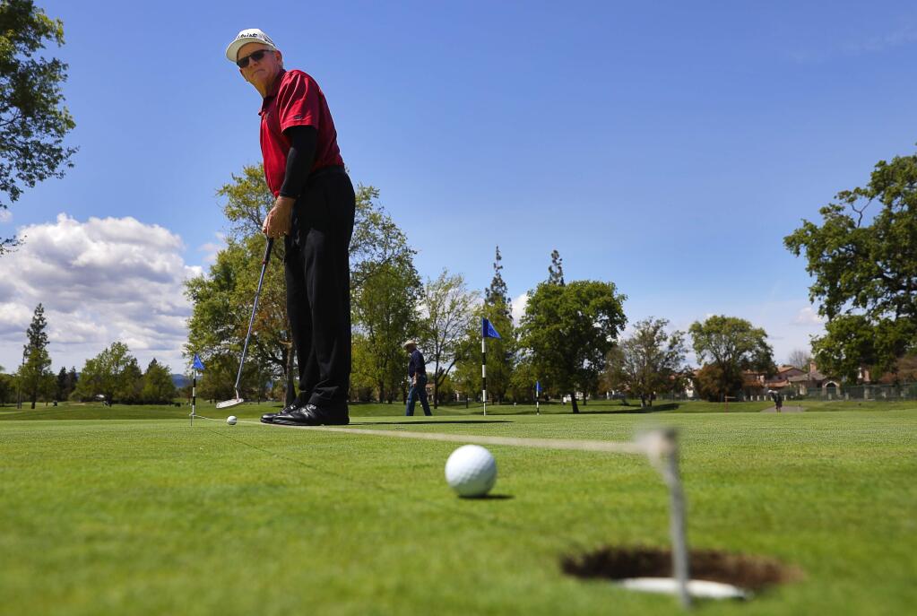 SRJC freshman golfer Ron Myers, 63, practices his putt at the Windsor Golf Club on Tuesday, April 17, 2018. Myers spent 22 years as the head coach of the SRJC baseball team, and served as athletic director at the school for a total of six and a half years.(Christopher Chung / The Press Democrat)