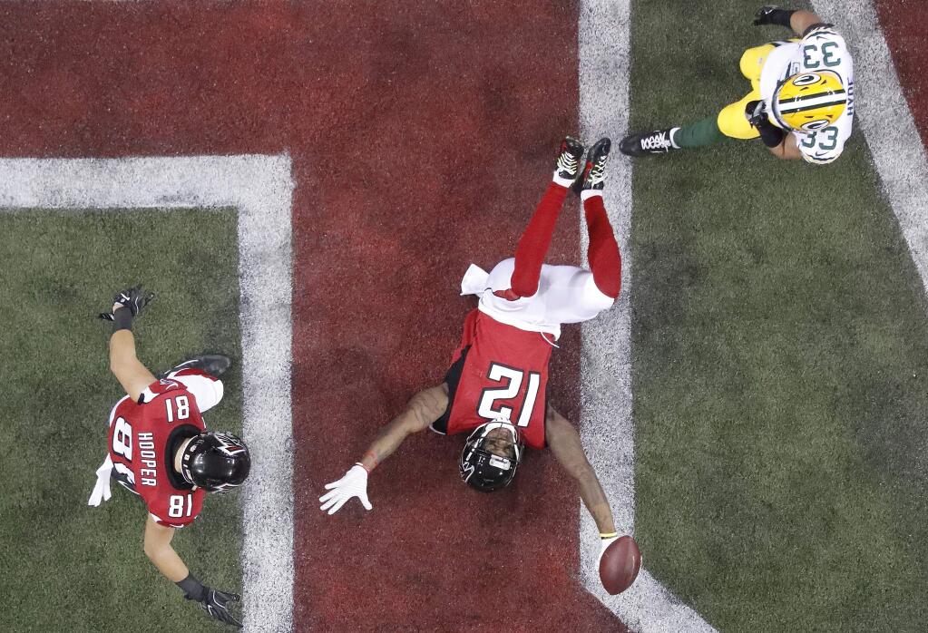 Atlanta Falcons' Mohamed Sanu reacts after catching a touchdown pass during the first half of the NFL football NFC championship game against the Green Bay Packers, Sunday, Jan. 22, 2017, in Atlanta. (AP Photo/John Bazemore)