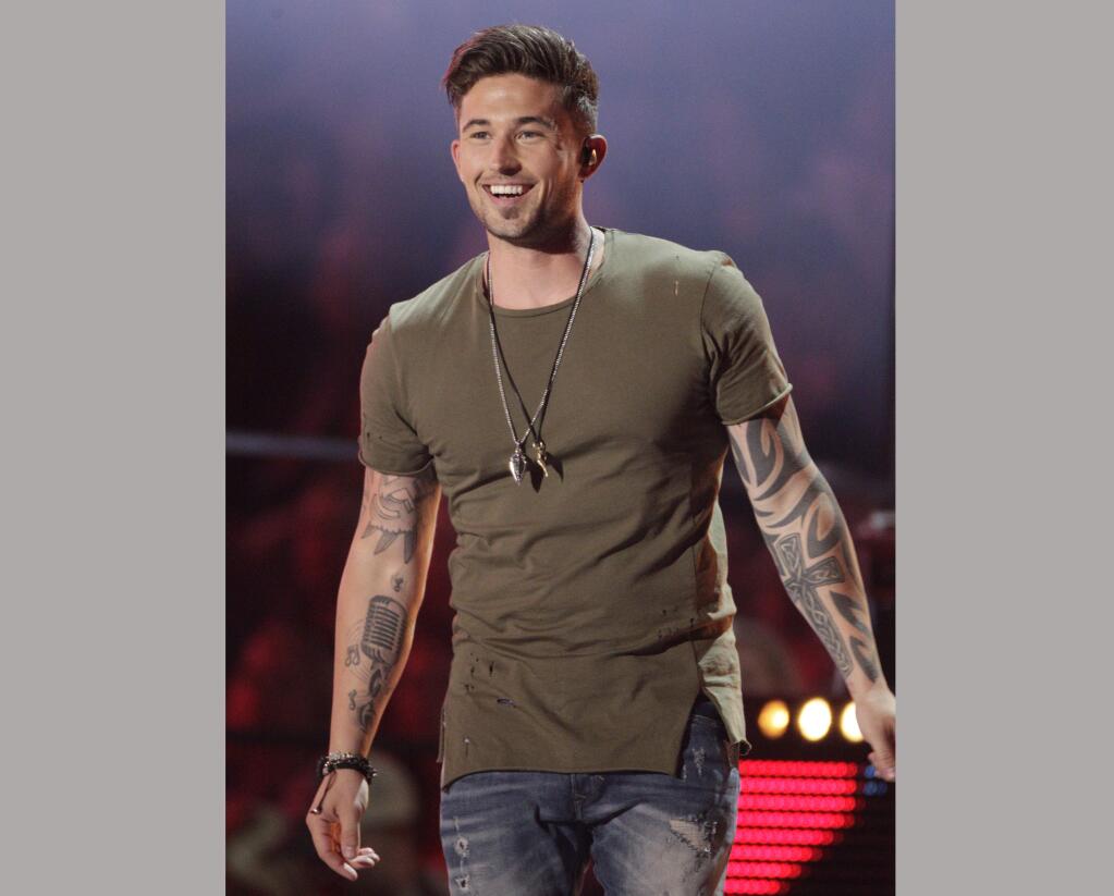FILE - In this June 8, 2016, file photo, Michael Ray performs 'Firestone' at the CMT Music Awards in Nashville, Tenn. Ray was arrested on drunken driving and drug charges after authorities say he crashed into a car at a fast-food restaurant drive-thru in Eustis, Fla., on Wednesday, Dec. 20, 2017. (Photo by Wade Payne/Invision/AP, File)