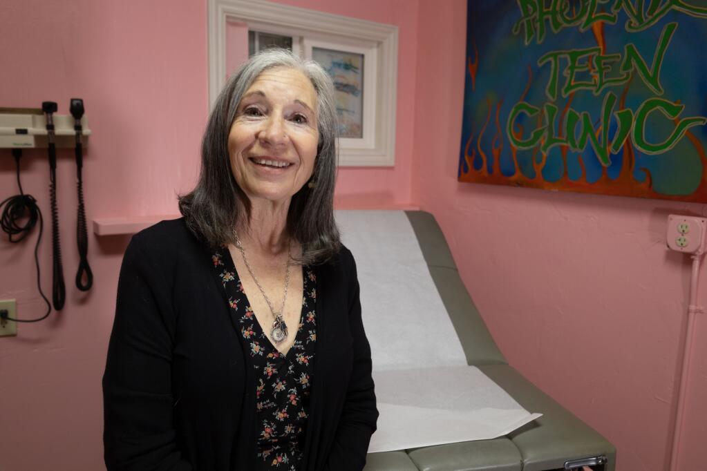 Cheryl Negrin, 70, at the Phoenix Teen Health Clinic exam room. After closing during COVID-19, the clinic will reopen on Wednesdays 3:30-5:30 p.m. (LINA HOSHINO)