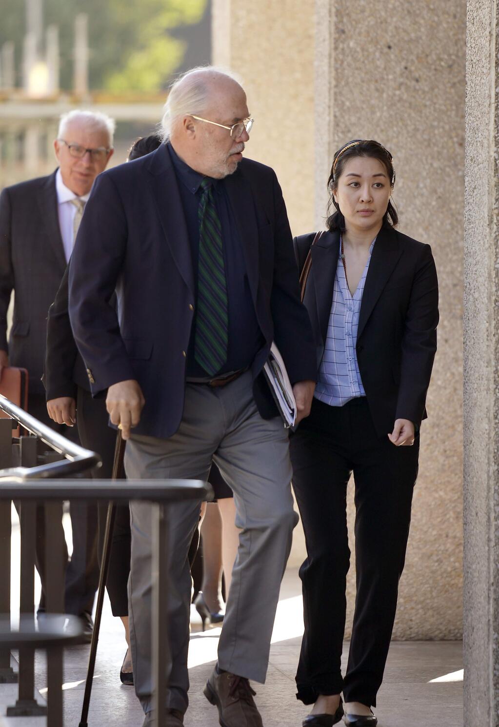 Tiffany Li, right, and her attorney Geoff Carr, left, arrive at the courthouse Thursday, Sept. 12, 2019, in Redwood City, Calif. The trial of Li, a Chinese real estate scion who posted a $35 million bail after being charged with orchestrating the 2016 murder of her children's father, is set to start Thursday.(AP Photo/Tony Avelar)