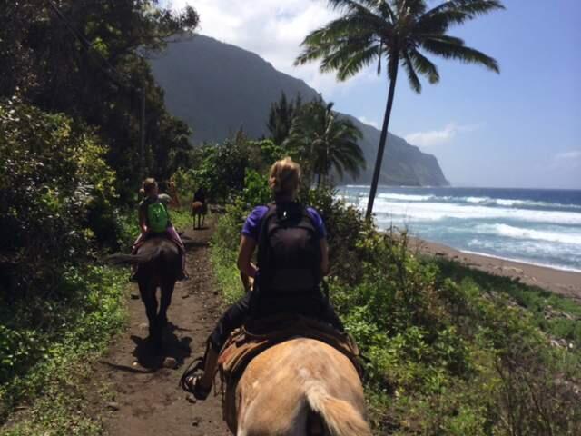 Riding along the beach before heading back up the trail from Kalaupapa on Molokai. (Virginia Mason)