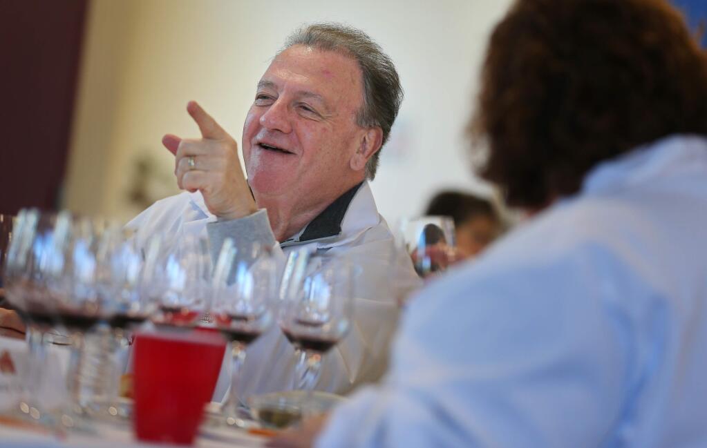 Charles Mara tries to convince a fellow wine judge to move his award for a wine up from silver to gold during the Sonoma County Harvest Fair Wine Competition, in Santa Rosa on Tuesday, September 17, 2019. (Christopher Chung/ The Press Democrat)