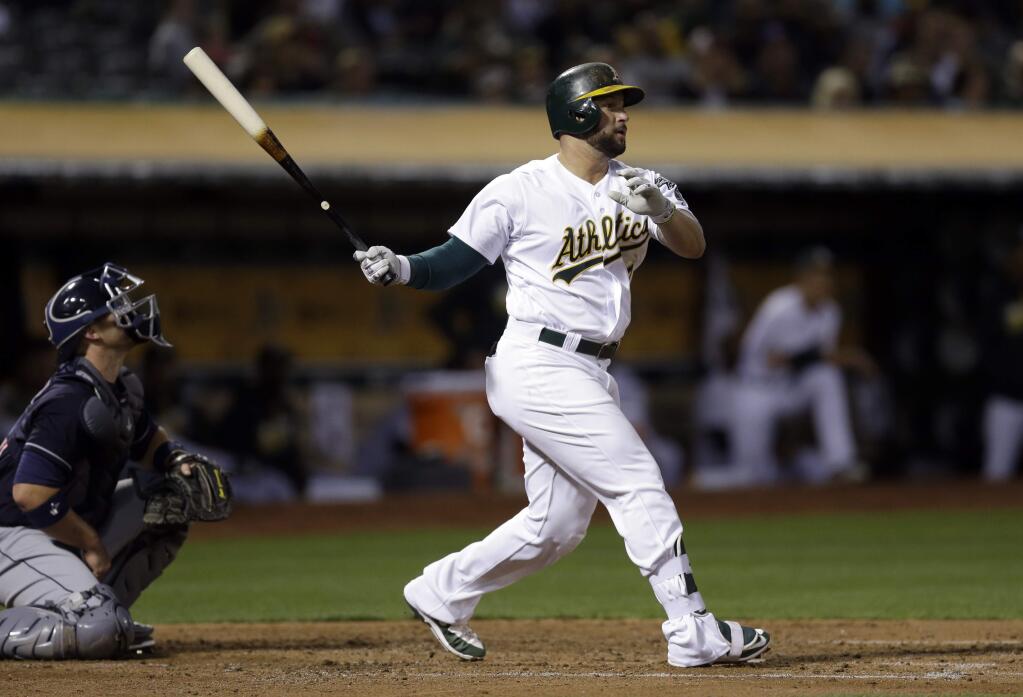 Oakland Athletics' Yonder Alonso follows through on an RBI sacrifice fly hit off Cleveland Indians' Danny Salazar in the third inning of a baseball game Tuesday, Aug. 23, 2016, in Oakland, Calif. (AP Photo/Ben Margot)
