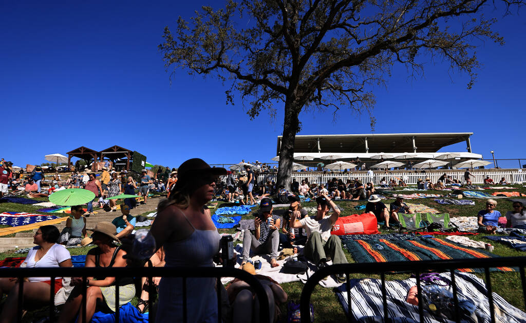 Shade was at a premium during the Sonoma Harvest Music Festival at B.R. Cohn Winery and Olive Oil Company, Saturday, Oct. 8, 2022, in Glen Ellen.  (Kent Porter / The Press Democrat) 2022