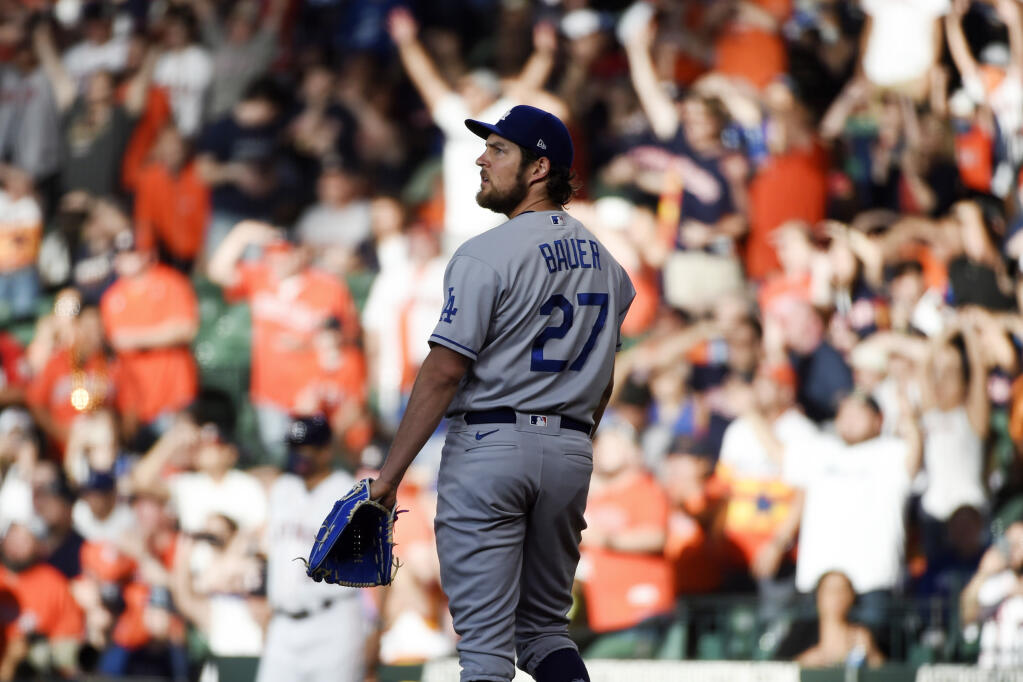 Los Angeles Dodgers starting pitcher Trevor Bauer watches the solo home run of the Houston Astros’ Jose Altuve during the first inning on Wednesday, May 26, 2021, in Houston. (Eric Christian Smith / ASSOCIATED PRESS)
