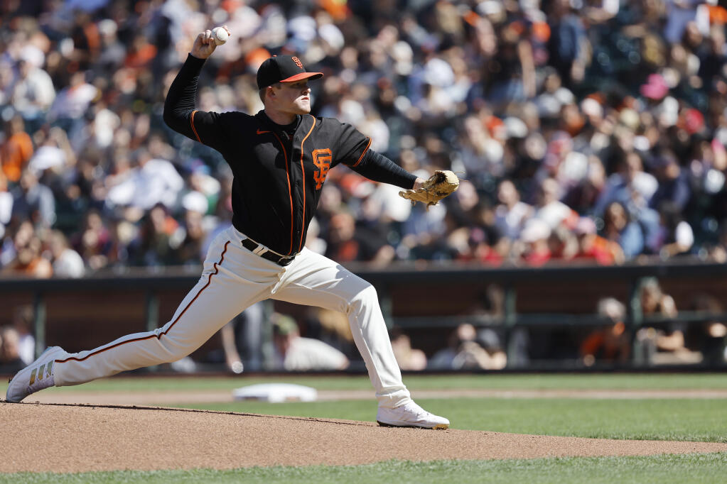 Giants starting pitcher Logan Webb throws against the Cincinnati Reds during the first inning in San Francisco on Saturday, June 25, 2022. (Josie Lepe / ASSOCIATED PRESS)