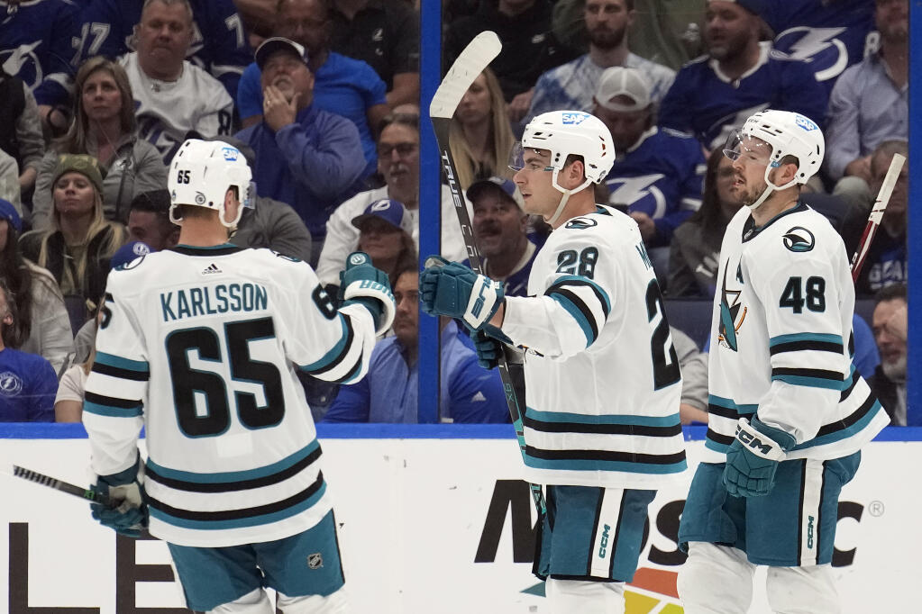 Sharks right wing Timo Meier, center, celebrates his goal against the Tampa Bay Lightning with defenseman Erik Karlsson, left, and center Tomas Hertl during the second period Tuesday, Feb. 7, 2023, in Tampa, Florida. (Chris O’Meara / ASSOCIATED PRESS)