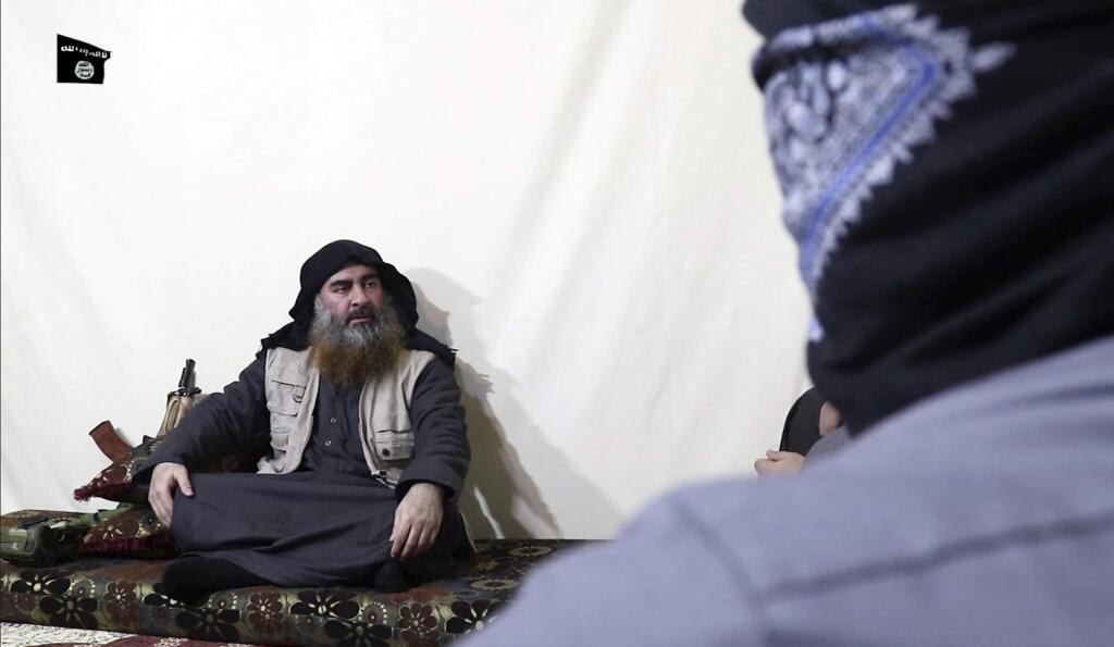 This image made from video posted on a militant website on Monday, April 29, 2019, purports to show the leader of the Islamic State group, Abu Bakr al-Baghdadi, being interviewed by his group's Al-Furqan media outlet. Al-Baghdadi acknowledged in his first video since June 2014 that IS lost the war in the eastern Syrian village of Baghouz that was captured last month by the Kurdish-led Syrian Democratic Forces. (Al-Furqan media via AP)