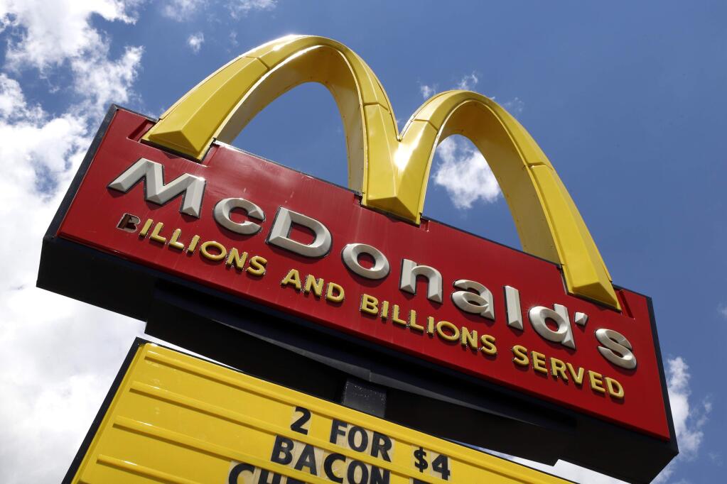 FILE - In this June 25, 2019 file photo a sign is displayed outside a McDonald's restaurant in Pittsburgh. (AP Photo/Gene J. Puskar, File)