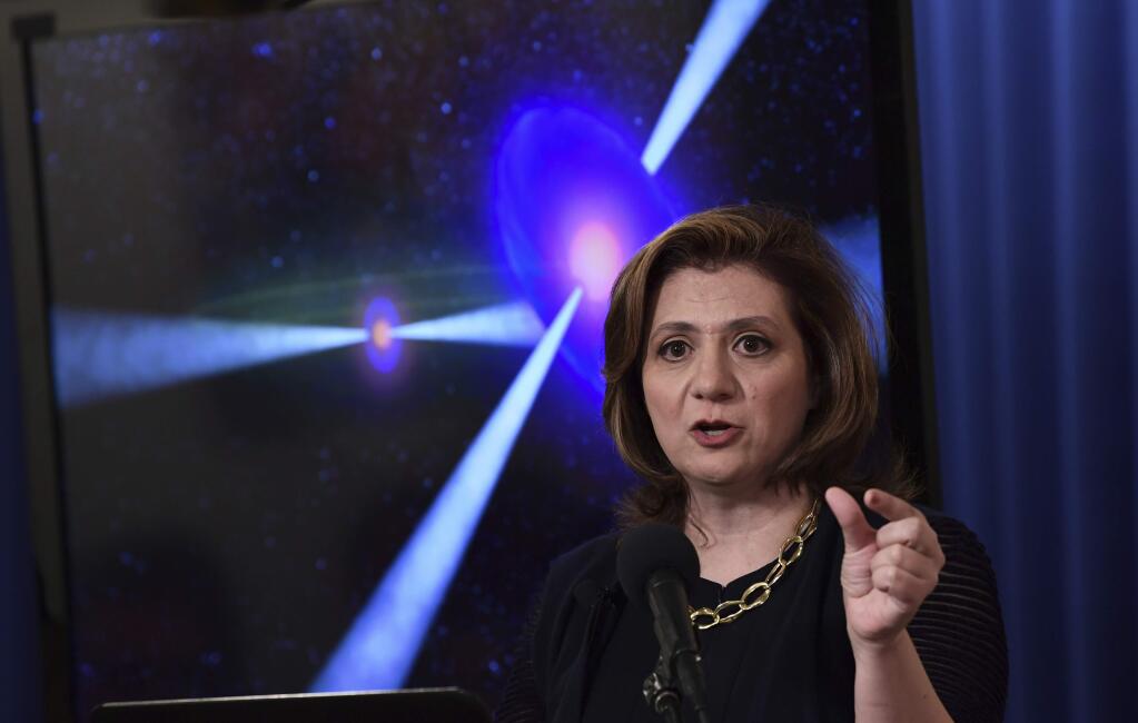 Vicky Kalogera, a gravitational-wave astrophysicist at Northwestern University who contributed to the historic detections of gravitational waves, speaks at the National Press Club in Washington, Monday, Oct. 16, 2017, during an announcement on one of the most violent events in the cosmos that was witnessed completely for the first time in August and tells scientists where gold and other heavy elements come from. (AP Photo/Susan Walsh)