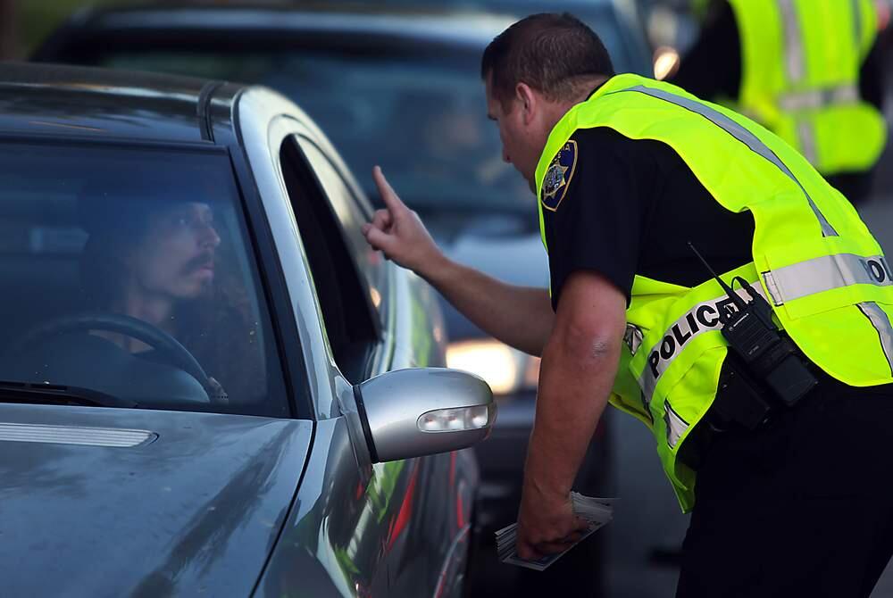 (File photo) Petaluma police officers conduct a DUI checkpoint on Sonoma Mountain Parkway, Friday Sept. 16, 2011 in Petaluma. The driver of the car was not under the influence. (Kent Porter / Press Democrat) 2011