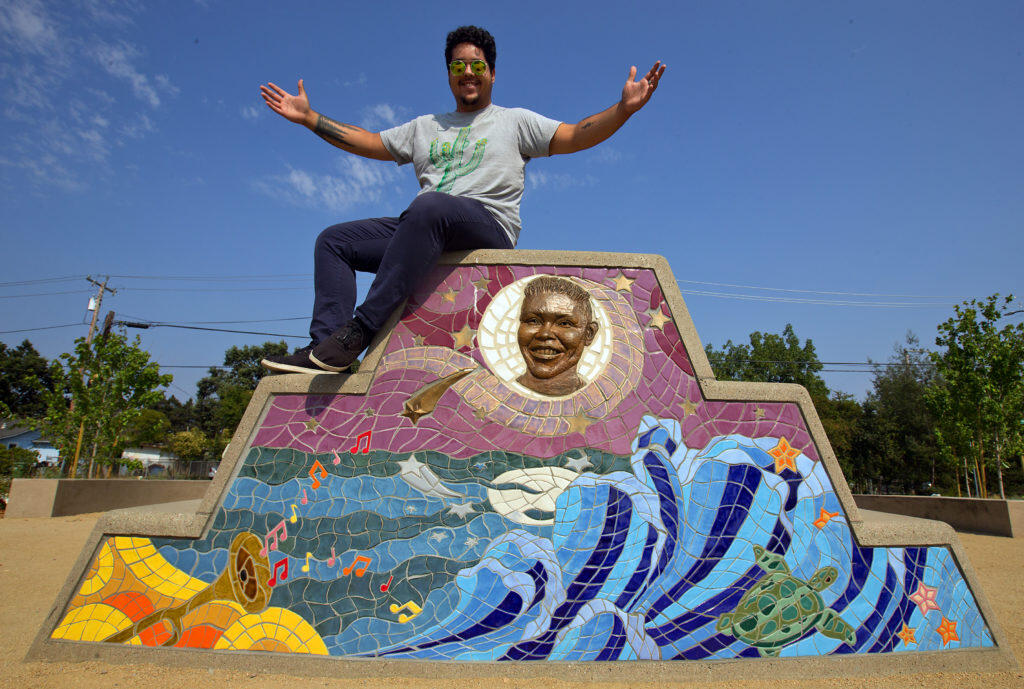 Herbert Martinez and other students worked with teacher Peter Schifrin of SF Art Institute to create a monument to Andy Lopez with 975 handmade tiles and 15 bronze elements at Andy’s Unity Park in Santa Rosa.  (photo by John Burgess/The Press Democrat)
