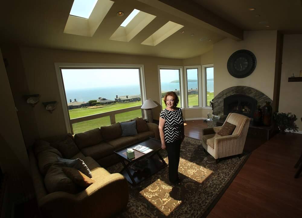 Thera Buttaro with Bodega Bay & Beyond vacation home rentals inside one of the homes she offers for rent in Bodega Harbour. (photo by John Burgess/The Press Democrat)