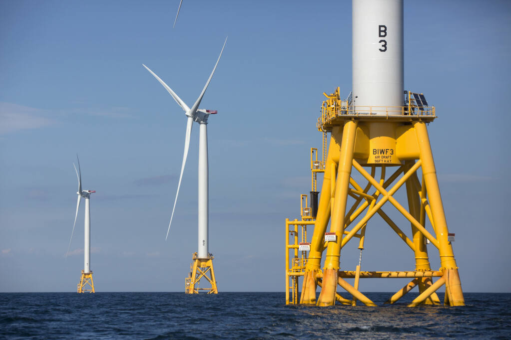 Three offshore wind turbines operate off the coast of Rhode Island. The first leases off California will be auctioned off today. Photo by Michael Dwyer, AP Photo