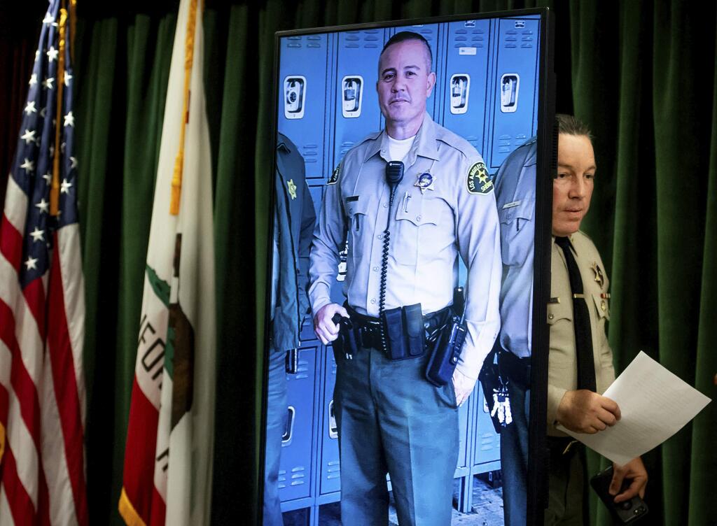Los Angeles County Sheriff Alex Villanueva arrives to a news conference in Los Angeles on Tuesday, June 11, 2019. Rhett Nelson, 30, of St. George, Utah, was arrested Tuesday on suspicion of shooting an off-duty Los Angeles County sheriff's deputy at a fast-food restaurant Monday, and authorities say they are investigating whether he may have killed another man an hour earlier in attacks that both appear to be random. (Sarah Reingewirtz/The Orange County Register via AP)