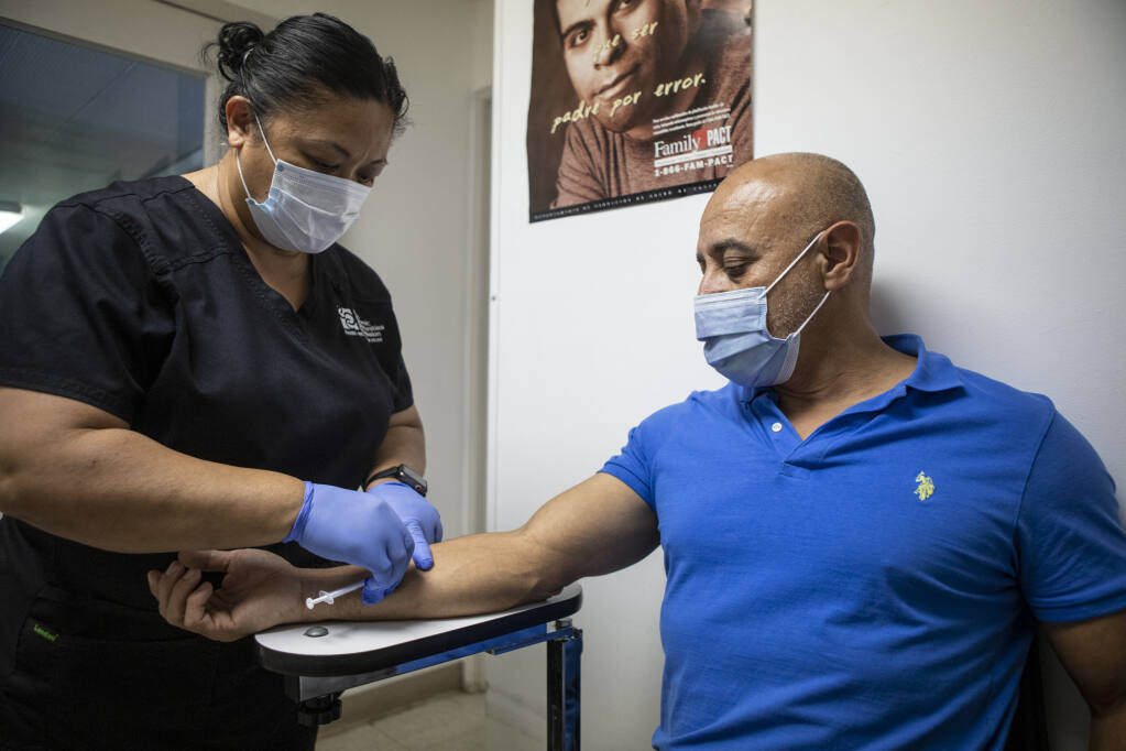 Fresno resident Gonzalo Garcia receives the mpox vaccine on Aug. 24, 2022. Photo by Larry Valenzuela, CalMatters/CatchLight Local