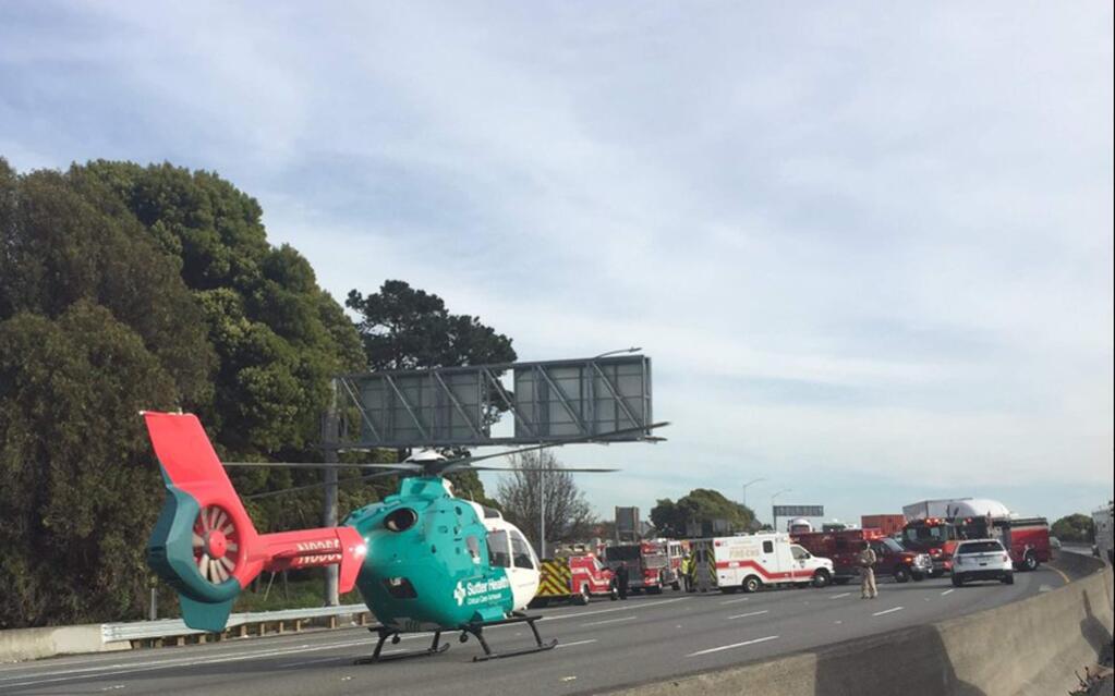 In this photo released by the California Highway Patrol Oakland Area Office shows a helicopter taking a victim to a hospital after a few motorists were shot while traveling on eastbound Interstate 80 in Richmond, Calif., about 12 miles north of San Francisco March 9, 2017. CHP officer Sean Wilkenfeld told local media it appears at least two people were shot. Investigators closed the eastbound lanes, snarling the evening commute. (California Highway Patrol Oakland Area Office via AP)