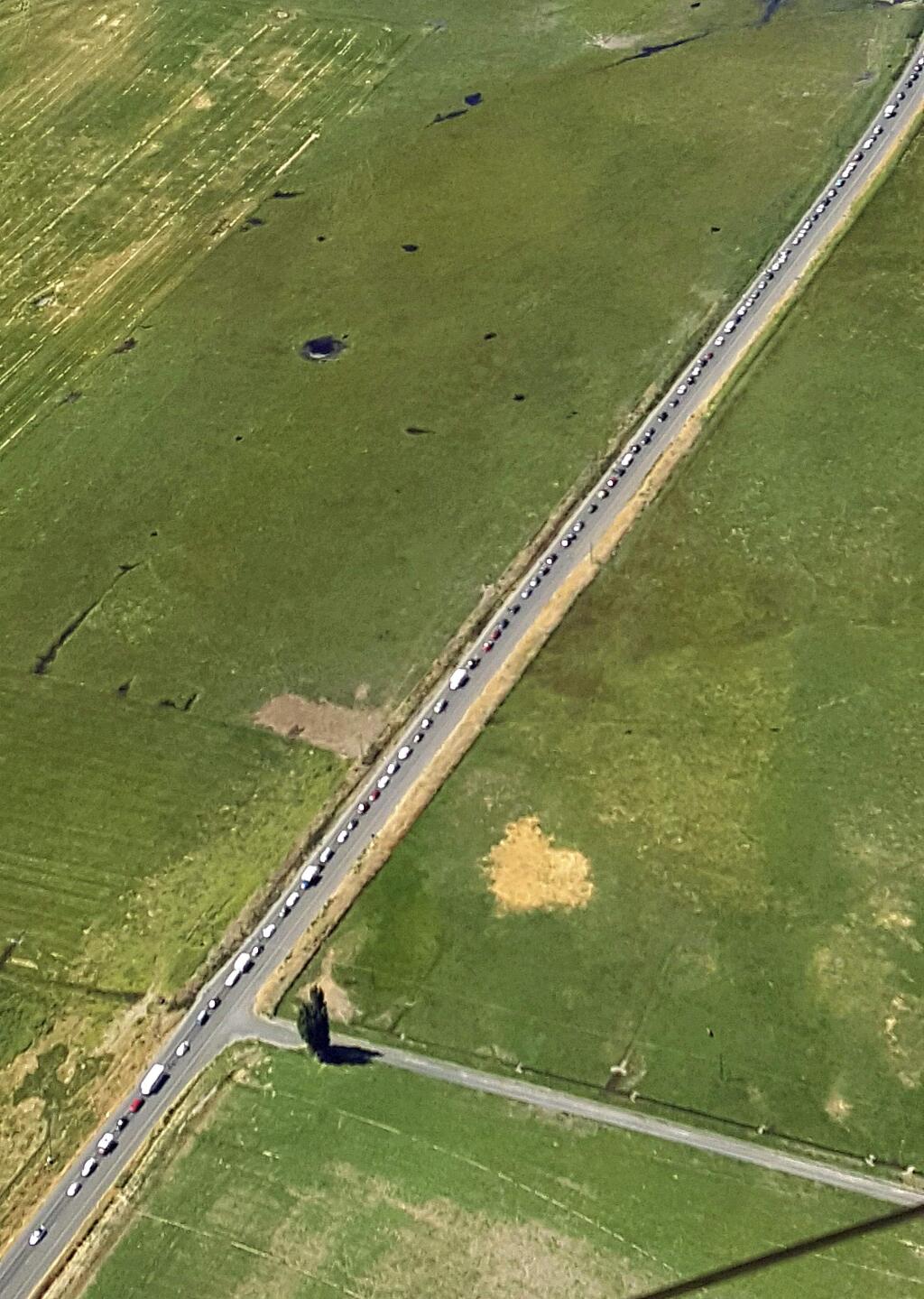 This aerial photo provided by the Oregon State Police shows a 15-mile traffic jam on Highway 26 heading in to Prineville, Ore., Thursday, Aug. 17, 2017. Traffic is already a headache in central Oregon as thousands of people are arriving before Monday's total solar eclipse. (Oregon State Police via AP)
