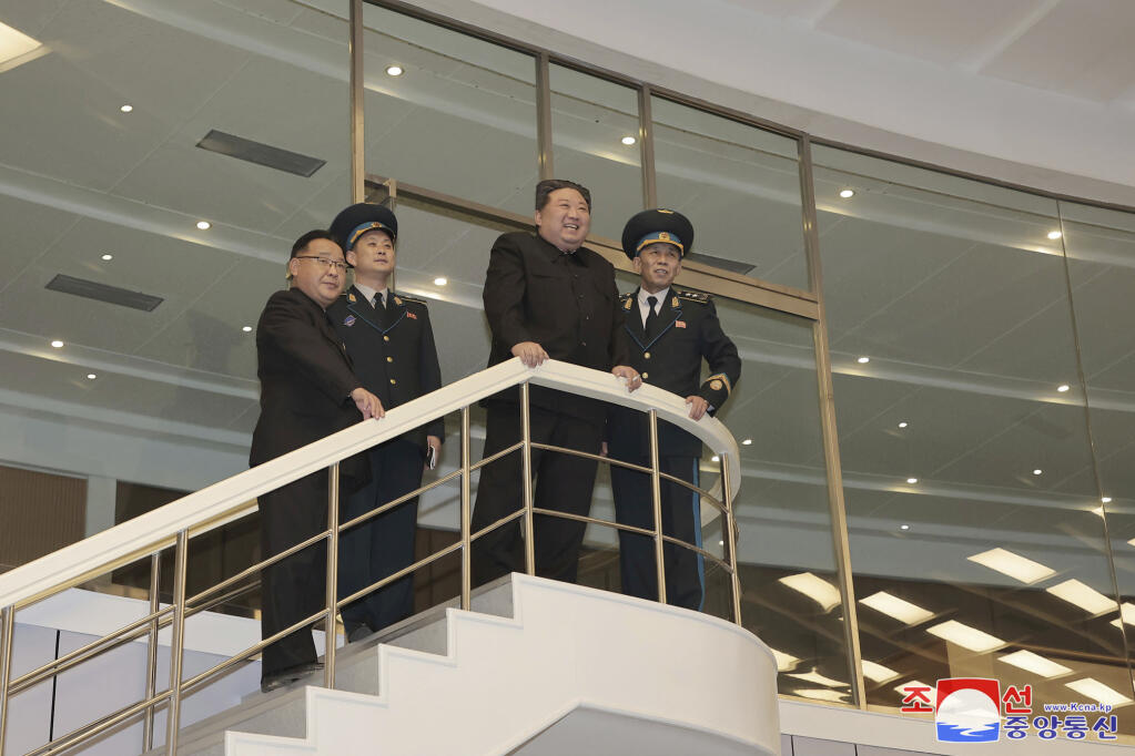 In this photo provided by the North Korean government, North Korean leader Kim Jong Un watches conditions of a satellite at a satellite control center in Pyongyang, North Korea, Wednesday, Nov. 22, 2023, after North Korea’s space agency said its new “Chollima-1” carrier rocket accurately placed the Malligyong-1 satellite into orbit on Tuesday night. Independent journalists were not given access to cover the event depicted in this image distributed by the North Korean government. The content of this image is as provided and cannot be independently verified. Korean language watermark on image as provided by source reads: "KCNA" which is the abbreviation for Korean Central News Agency. (Korean Central News Agency/Korea News Service via AP)