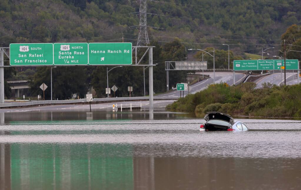 Flood waters forced the Jan. 23 closure of all lanes in both directions of Highway 37 east of the Hannah Ranch Road exit. (CHRISTOPHER CHUNG / The Press Democrat)