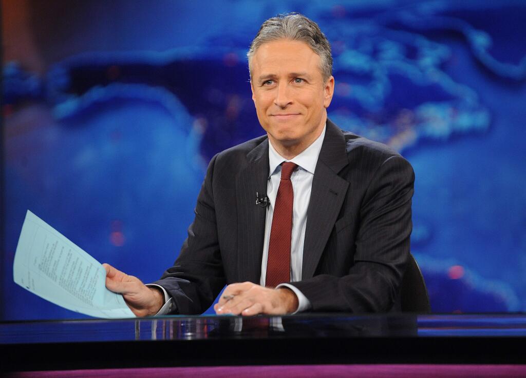 FILE - This Nov. 30, 2011 file photo shows television host Jon Stewart during a taping of 'The Daily Show with Jon Stewart' in New York. Comedy Central announced Tuesday, Feb. 10, 2015, that Stewart will will leave 'The Daily Show' later this year. (AP Photo/Brad Barket, File)