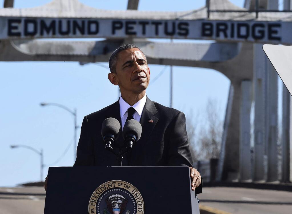 FILE - In this March 7, 2015 file photo, President Barack Obama speaks near the Edmund Pettus Bridge, in Selma, Ala. (AP Photo/Bill Frakes, File)