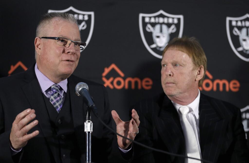 Oakland Coliseum Joint Powers Authority member and Alameda County Supervisor Scott Haggerty, left, gestures beside Oakland Raiders Owner Mark Davis during a media conference Thursday, Feb. 11, 2016, in Oakland. With the Oakland Raiders long-term plans still up in the air, team officials announced that the team had agreed to a one-year lease extension to remain at the O.Co Coliseum for the 2016 NFL season. (AP Photo/Ben Margot)