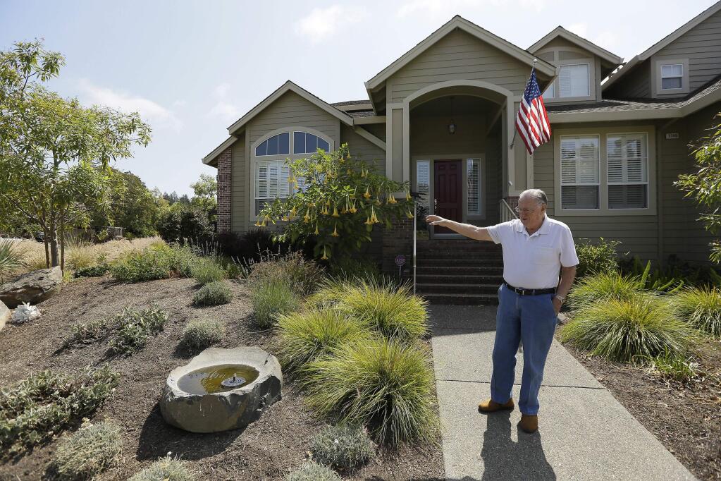 In this photo taken Tuesday, Aug. 23, 2016, Bill Crowell shows his garden made to use less amount of water at his home in the Fountaingrove neighborhood in Santa Rosa, Calif. California water agencies that spent more than $350 million in the last two years of drought to pay property owners to rip out water-slurping lawns are now trying to answer whether the nation's biggest lawn removal experiment was all worth the cost. (AP Photo/Eric Risberg)