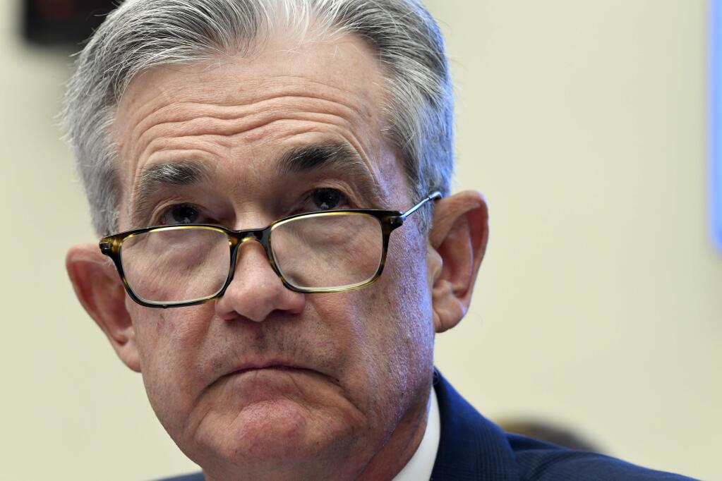 FILE - In this July 10, 2019, file photo Federal Reserve Chairman Jerome Powell testifies before the House Financial Services Committee on Capitol Hill in Washington. Powell has signaled that rising economic pressures, notably from President Donald Trump‚Äôs trade wars and from a global slowdown, have become cause for concern. (AP Photo/Susan Walsh, File)