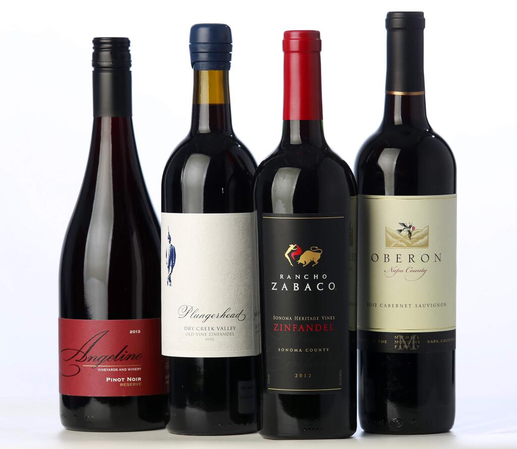 Budget wines: (l to r) Angeline Pinot Noir, Plungerhead Old Vines Zinfandel, Rancho Zobaco Zinfandel, and Oberon Cabernet Sauvignon. (JOHN BURGESS / The Press Democrat)