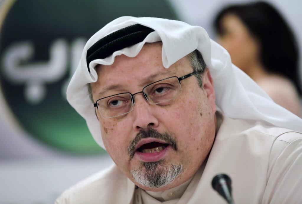 FILE - In this Dec. 15, 2014, file photo, Saudi journalist Jamal Khashoggi speaks during a press conference in Manama, Bahrain. Saudi state media said Thursday, Jan. 3, 2019, that suspects in the slaying of journalist Jamal Khashoggi have attended their first court hearing. The state-run Saudi Press Agency said that prosecutors plan to seek the death penalty for five of the 11 who were at the hearing. The brief statement did not name the suspects. (AP Photo/Hasan Jamali, File)