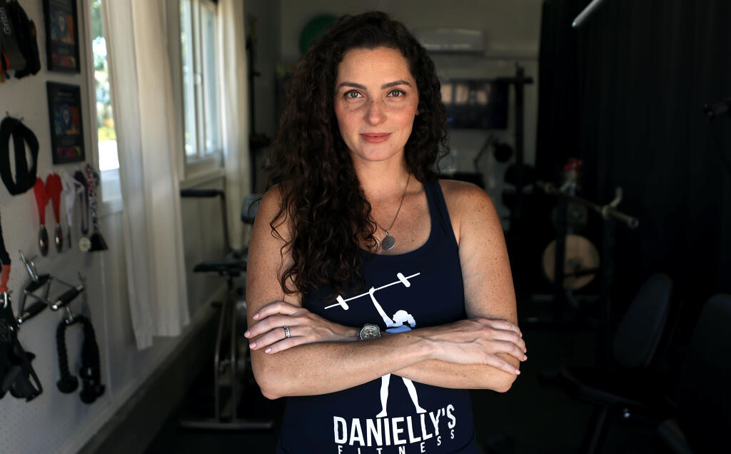 Danielly Rocha  of Danielly’s Fitness pauses in Sonoma, Friday, Aug. 25, 2023. (Kent Porter / The Press Democrat)