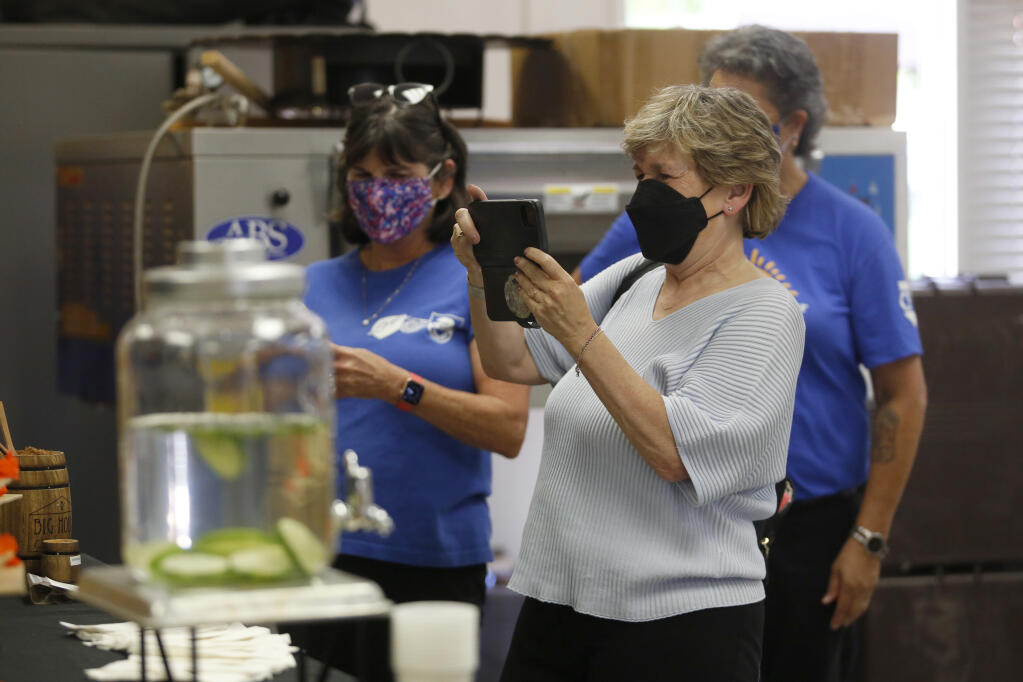Randi Weingarten, president of the American Federation of Teachers, takes a photo of the culinary arts class during a visit to Casa Grande High School in Petaluma on Tuesday, Aug. 24, 2021. (Beth Schlanker / The Press Democrat)