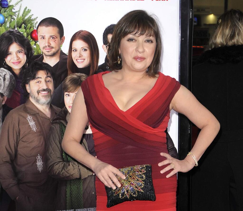 FILE - In this Dec. 3, 2008 file photo, Elizabeth Pena poses as she arrives for the Los Angeles premiere of 'Nothing Like the Holidays,' in Los Angeles. The 'La Bamba' and 'Lone Star' actress Pena, 55, has died. Pena's manager, Gina Rugolo, said the actress died Tuesday, Oct. 14, 2014, in Los Angeles of natural causes after a brief illness. (AP Photo/Mark J. Terrill, file)