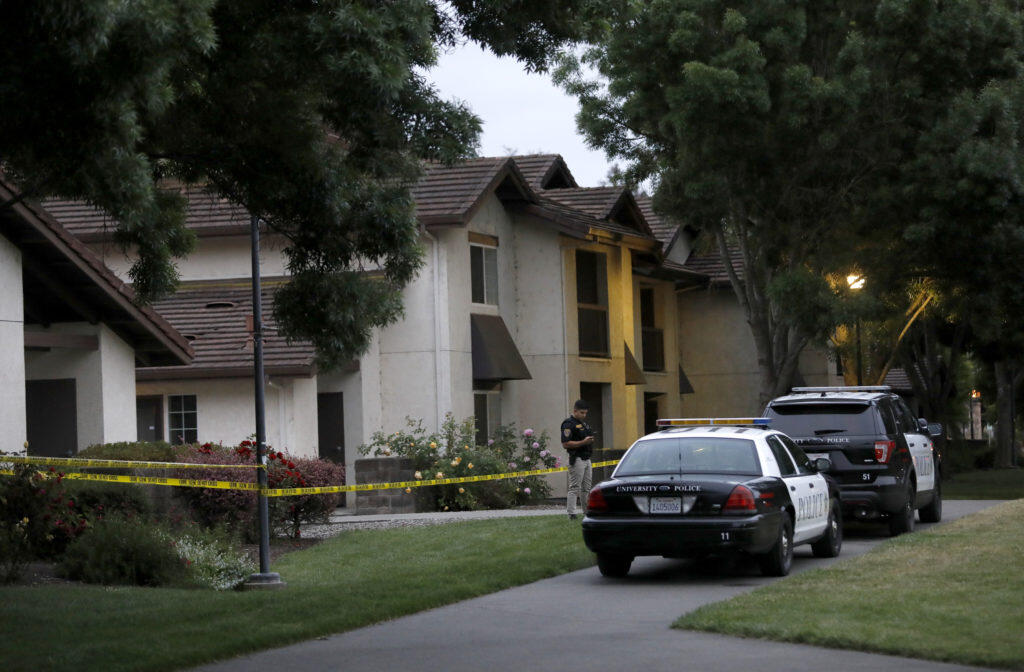 SSU police officers secure the scene of a fatal stabbing in the Alicante housing area of Sauvignon Village on the Sonoma State University campus on Sunday, May 13, 2018 in Rohnert Park, California . (BETH SCHLANKER/The Press Democrat)