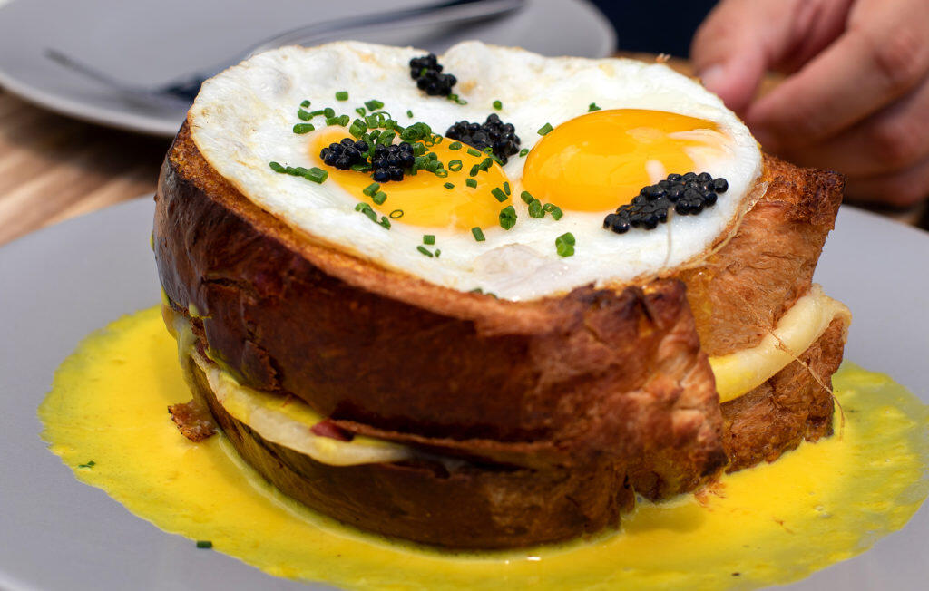 Croque Madame con langosta, jamón, queso, huevo frito, salsa de azafrán y caviar en Blue Ridge Kitchen en Sebastopol. (Heather Irwin / The Press Democrat)