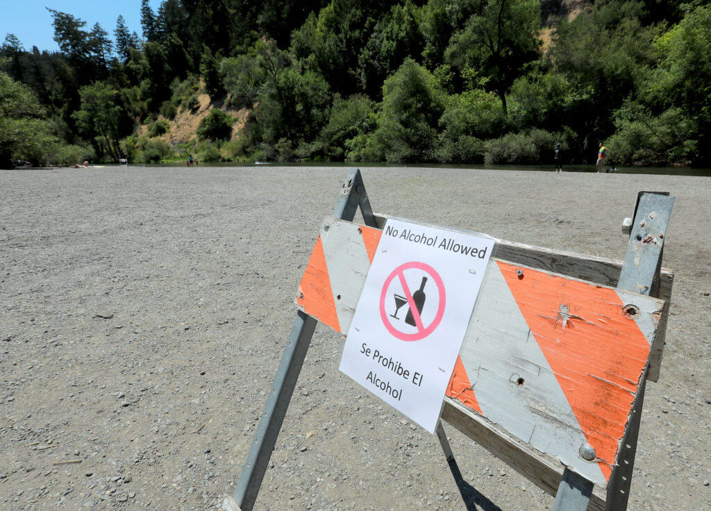 Signs at Mom’s Beach on the Russian River where alcohol has been prohibited for the past three years.  (photo by John Burgess/The Press Democrat)