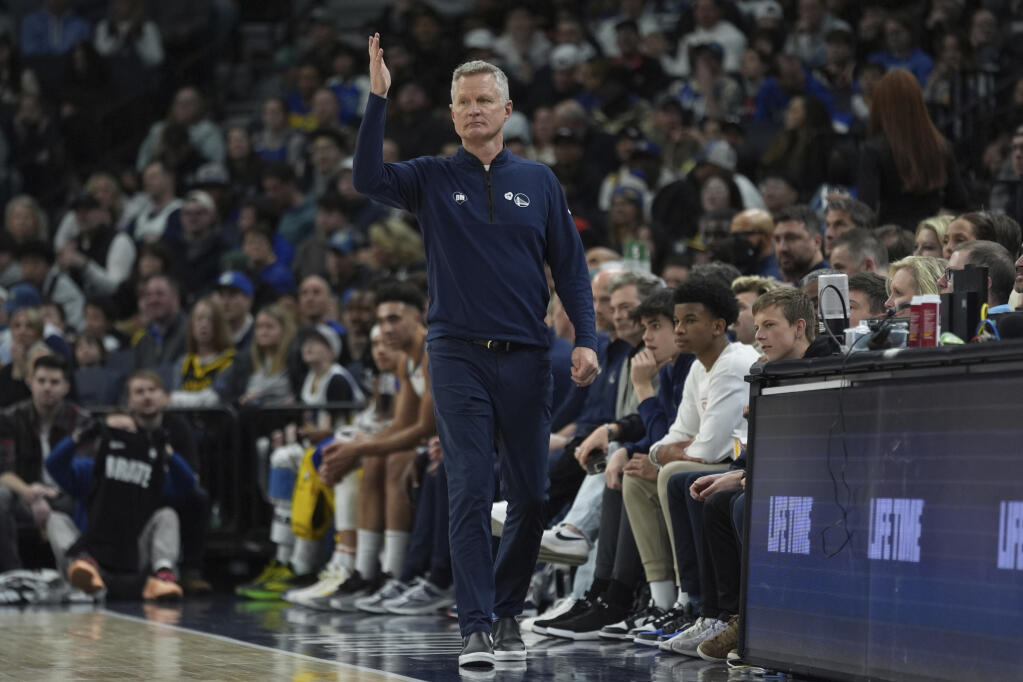 Golden State Warriors head coach Steve Kerr gestures during the first half of an NBA basketball game against the Minnesota Timberwolves, Sunday, March 24, 2024, in Minneapolis. (AP Photo/Abbie Parr)