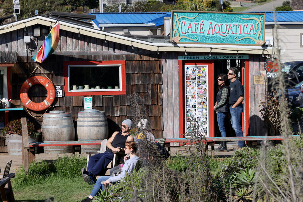 Customers listen to live music at Cafe Aquatica in Jenner, Sunday, Nov. 12, 2023. (Beth Schlanker / The Press Democrat)