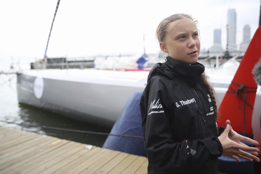 Greta Thunberg, a 16-year-old Swedish climate activist speaks to reporters on a dock next to the Malizia II after arriving in New York, Wednesday, Aug. 28, 2019. The zero-emissions yacht, the Malizia II, left Plymouth, England on Aug. 14. Thunberg is scheduled to address the United Nations Climate Action Summit on Sept. 23. (AP Photo/Mary Altaffer)