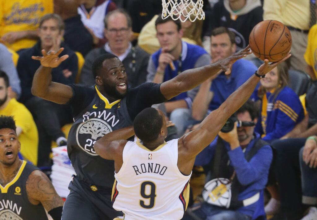 Golden State Warriors forward Draymond Green defends against guard Rajon Rondo during their game in Oakland on Tuesday, May 1, 2018. (Christopher Chung / The Press Democrat)