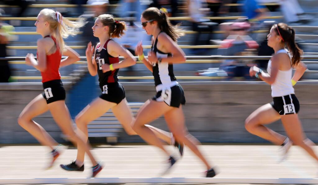 Gabrielle Peterson of Healdsburg, second from left, trails Kelli Wilson of Monte Vista in the girls' 3,200-meter run during the track and field NCS Meet of Champions, at UC Berkeley's Edwards Stadium, on Saturday, May 26, 2018. (Photo by Darryl Bush / For The Press Democrat)