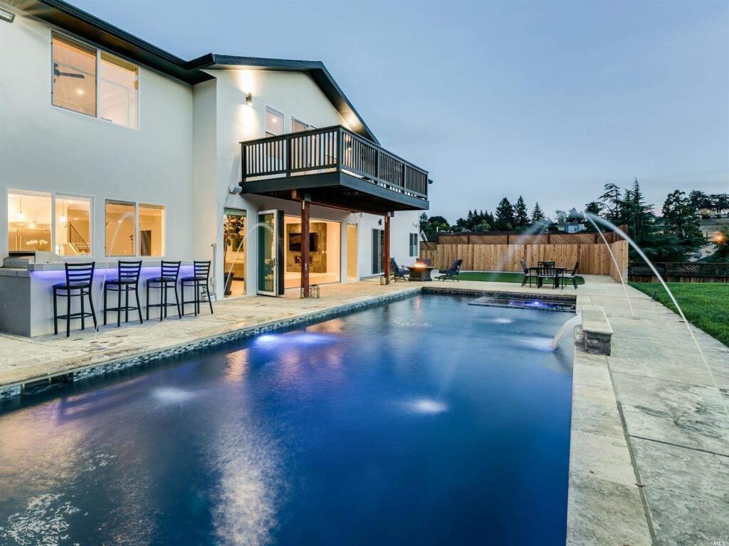 A poolside entertainment area with an outdoor bar and fountain. Property listed by Timo Rivetti/Keller Williams Real Estate, rivettirealestate.com, 707-477-8396. (Photos courtesy of BAREIS MLS)