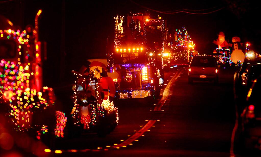 Geyserville's lighted tractor parade rolls down Geyserville Avenue. (Kent Porter / Press Democrat, file 2012)