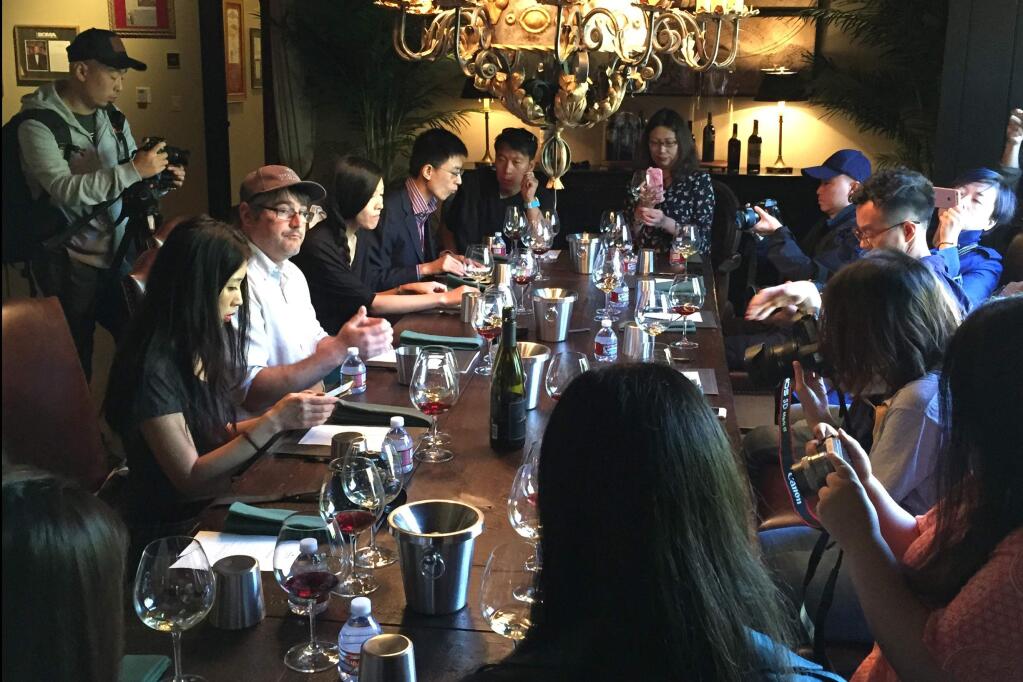 A delegation writers, photographers and tourism professionals from China toured Buena Vista Winery this week, pulling out their cell phones to document every swirl and sip. (Photo courtesy Tamara Stanfill/Boisset Collection)